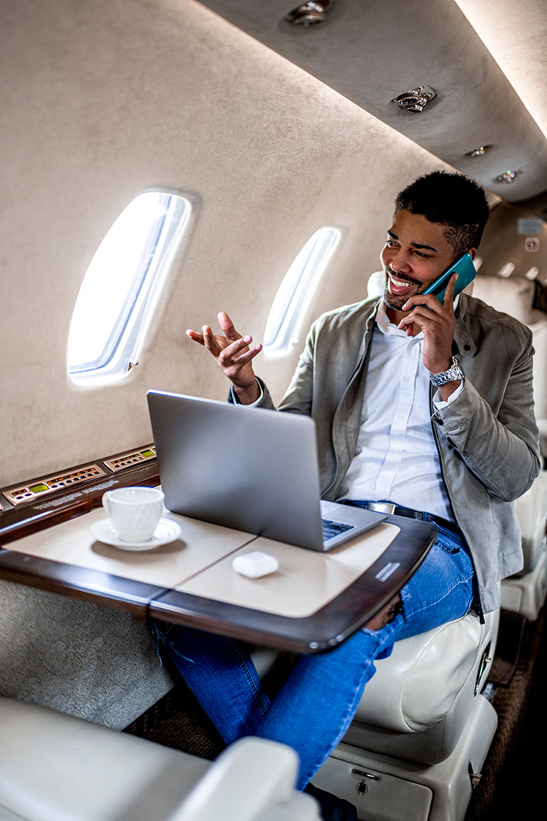 high net worth individual working in a jet plane